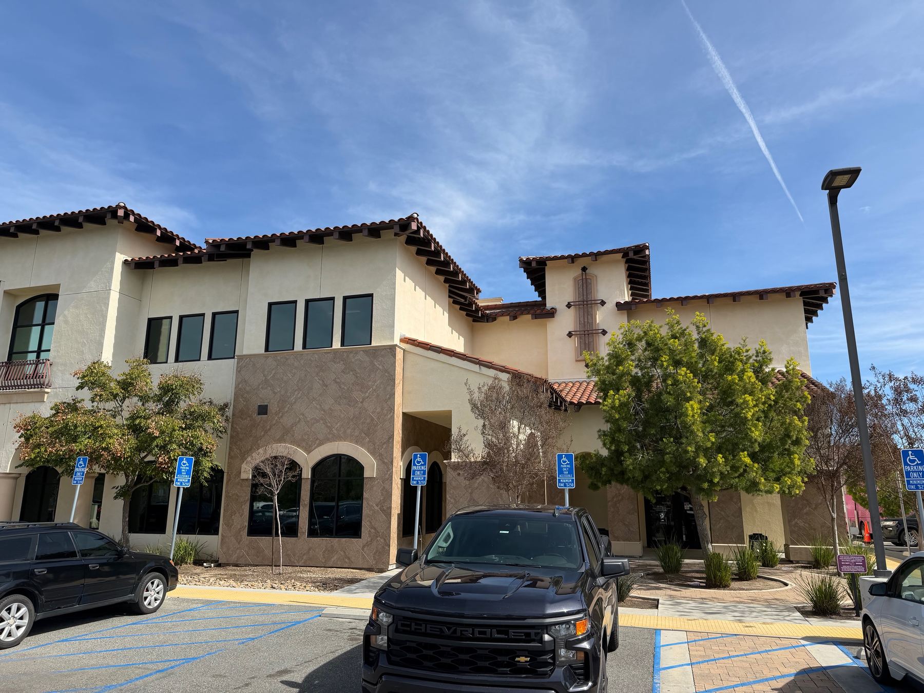 Two-story building shell with window openings, exterior panel system