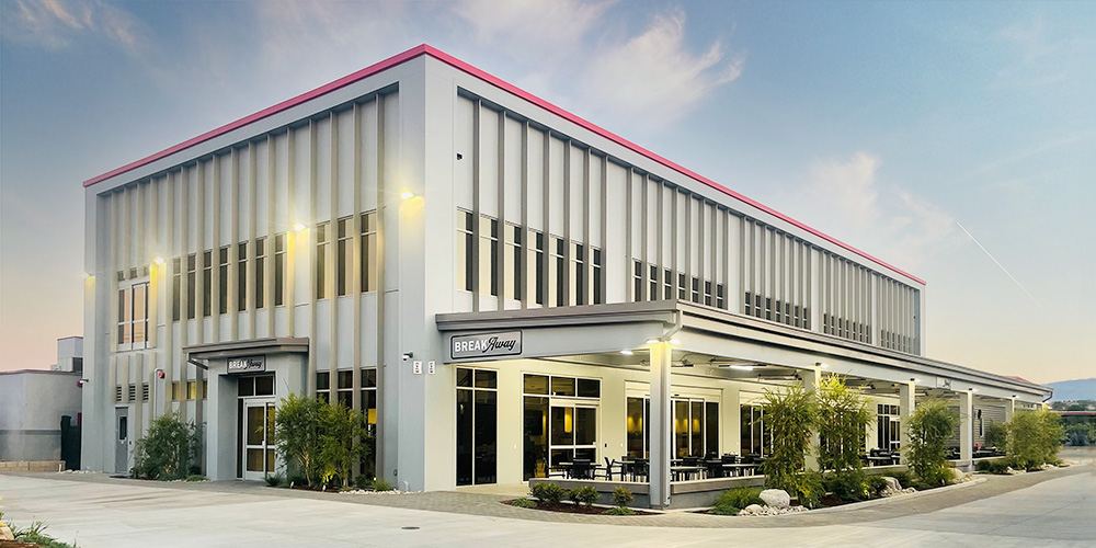 Completed two-story commercial office building at dusk